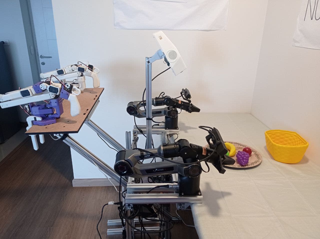 A conventional bimanual leader-follower setup with two leader arms and two follower arms